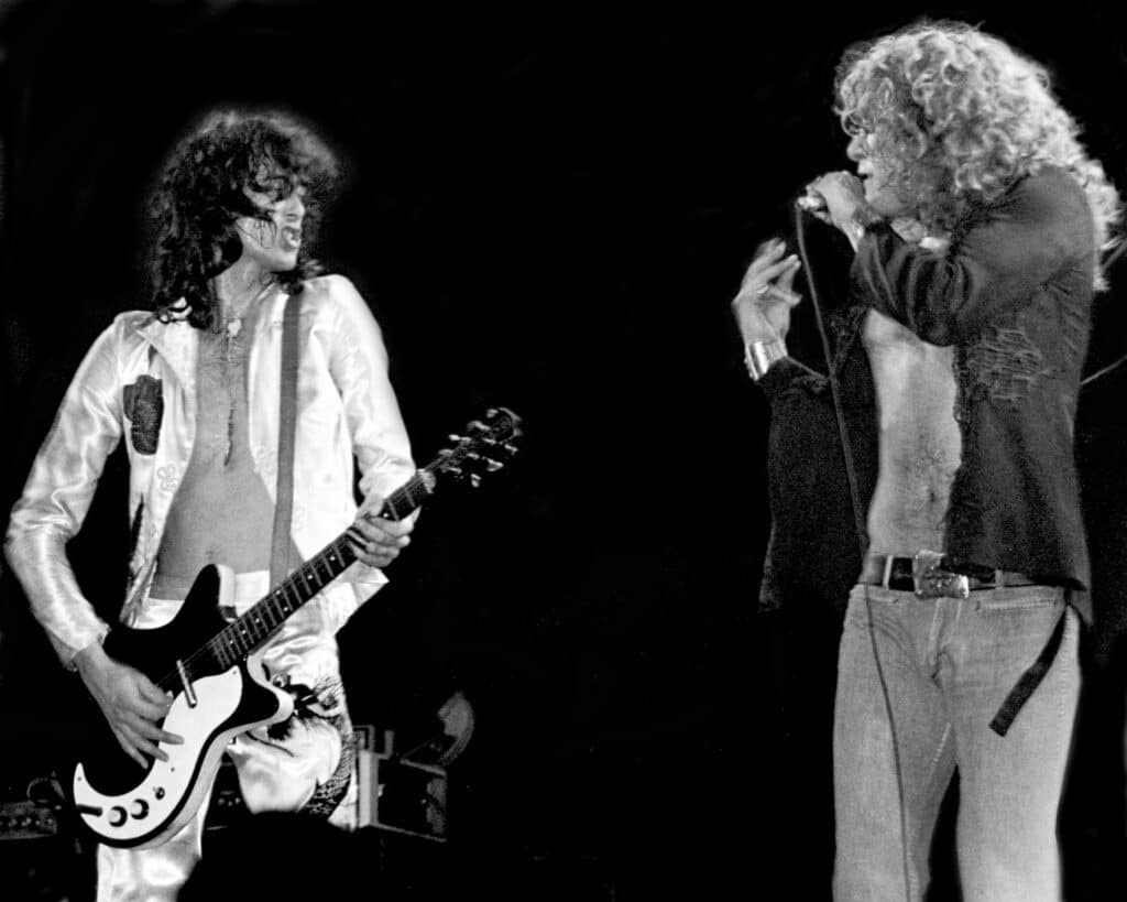 Jimmy Page and Robert Plant of Led Zeppelin onstage bare-chested at Madison Square Garden in New York City in 1977.